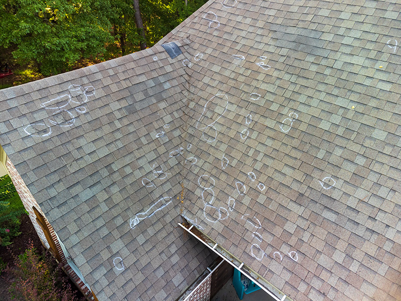 Residential Home Roof with Hail Damage